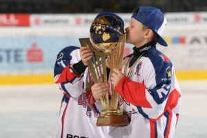 One player from CSKA Moscow kisses the top of the World Selects Invitational Trophy in celebration.