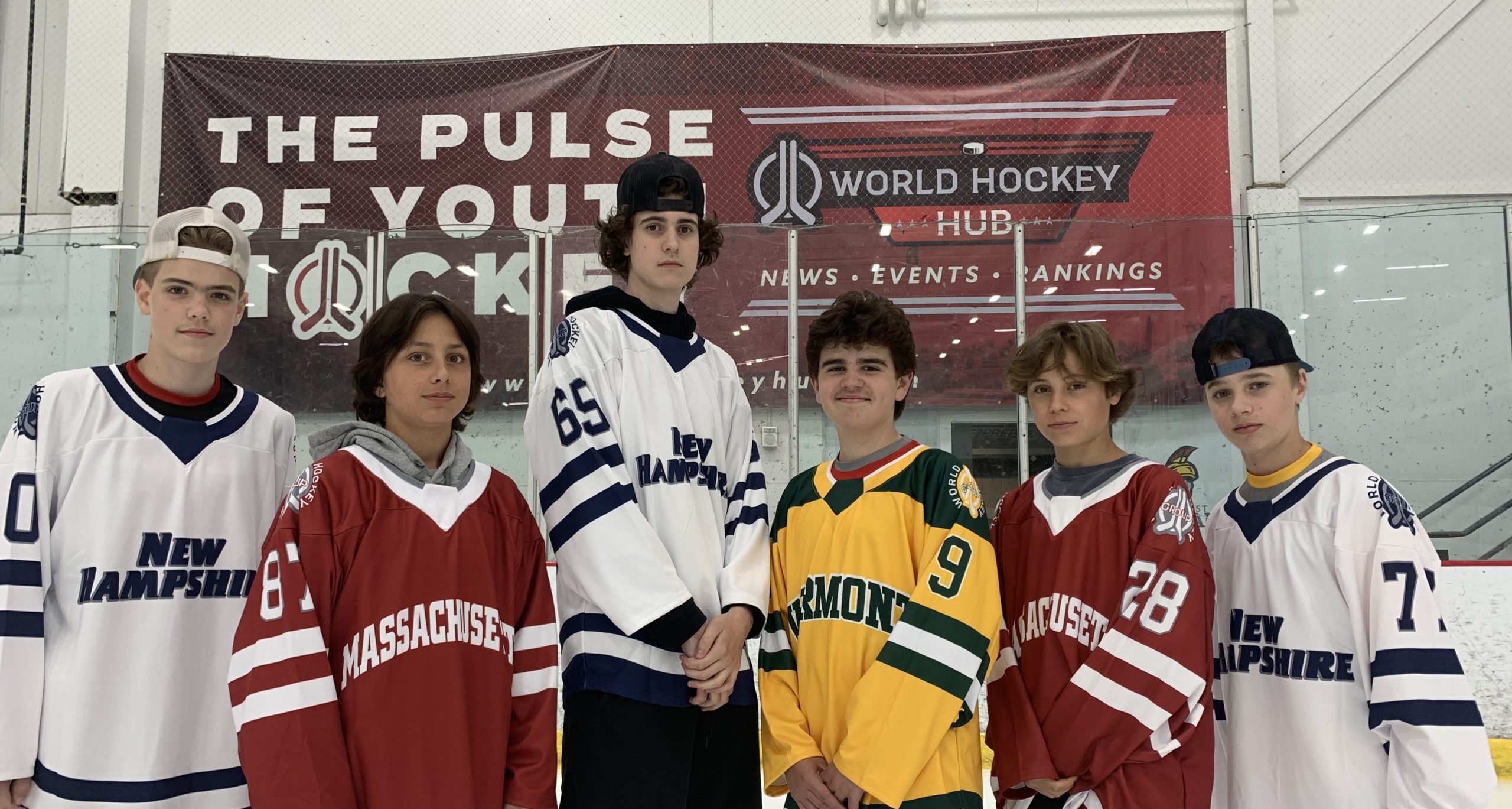 Players pose in jerseys for the New England States Rivalry Challenge.