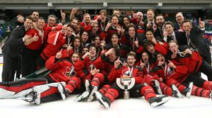Team Canada poses for a championship photo after winning the 2021 IIHF World Junior Championships.