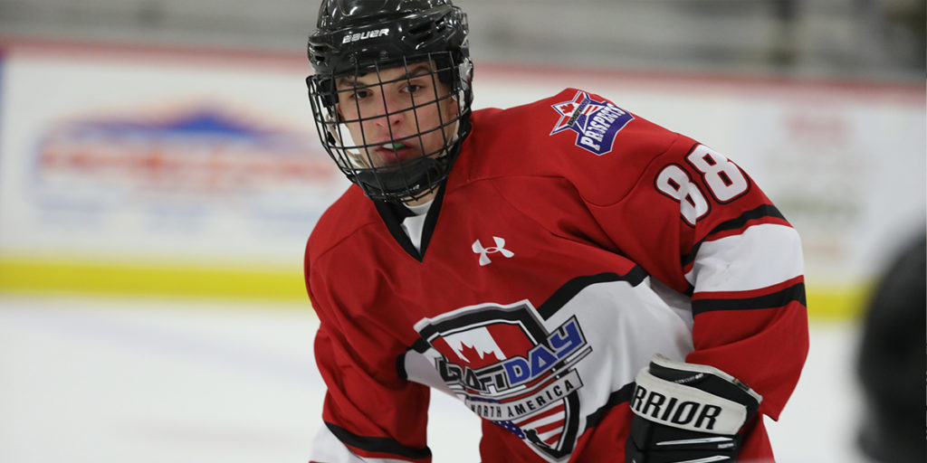 A player for DraftDay Red skates up the ice during a game at the 2019 World Selects Invitational.