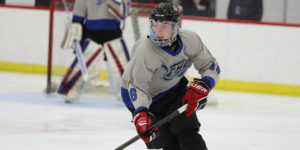 A player from Elite Hockey Group's spring team skates up the ice at the 2019 World Selects Invitational.