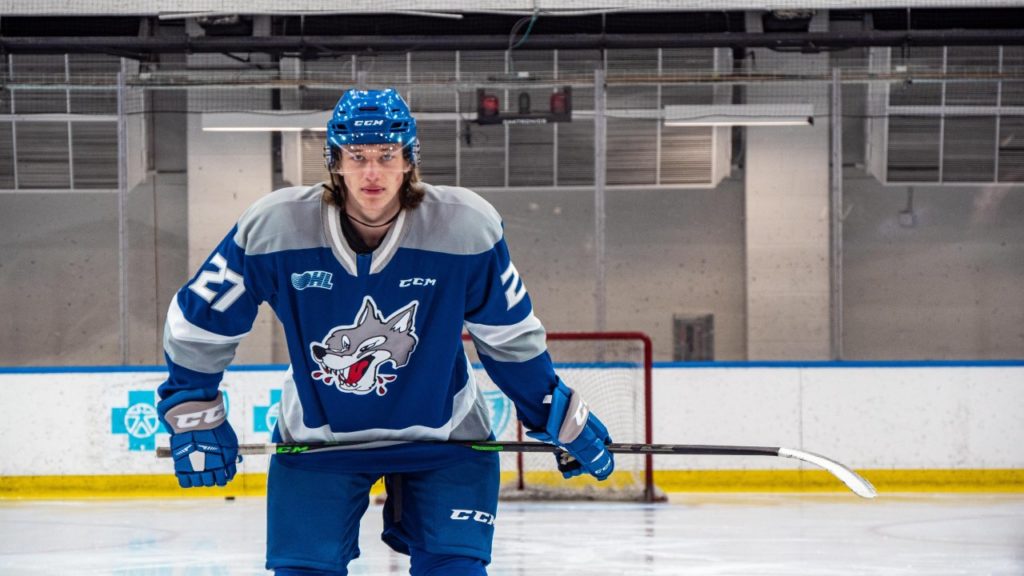 Forward Quentin Musty poses on the ice in a Sudbury Wolves uniform after being selected first overall in the OHL Draft.