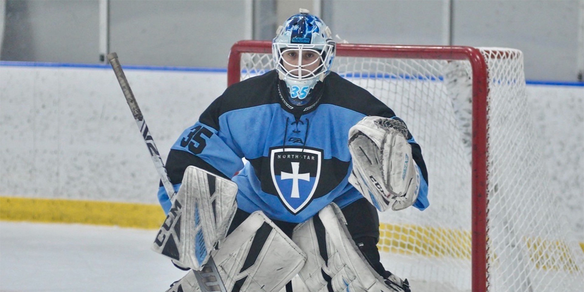 Goaltender C.J. Kier stands in net for Northstar Christian Academy during a youth hockey game.