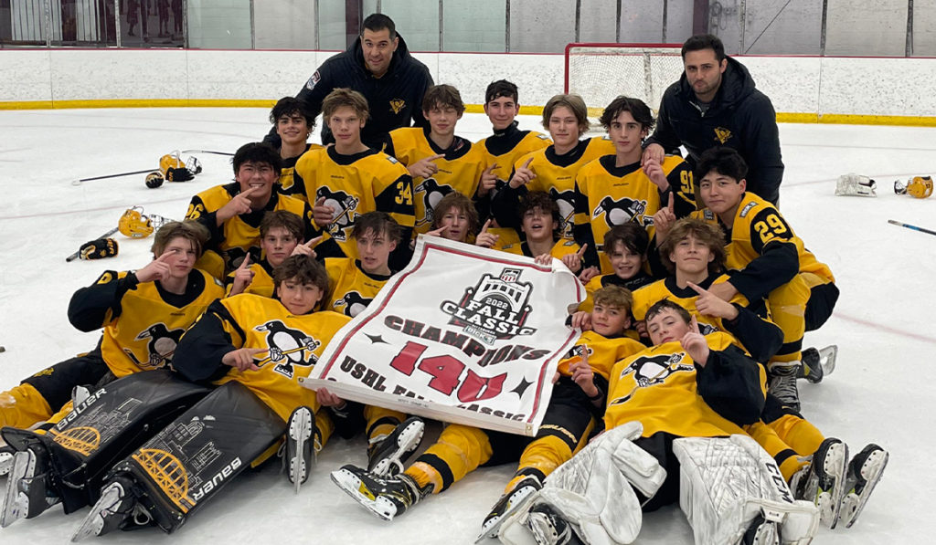The 2008-born Pittsburgh Penguins Elite pose for a team picture after winning the 14U division at the 2022 USHL Fall Classic