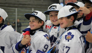 Players from the Toronto Marlboros gather in celebration after winning the 2019 Motown Classic.