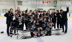 The 2009 Huron-Perth Lakers pose for a photo after winning the 2022 U13 Ontario Hockey Federation Championships.