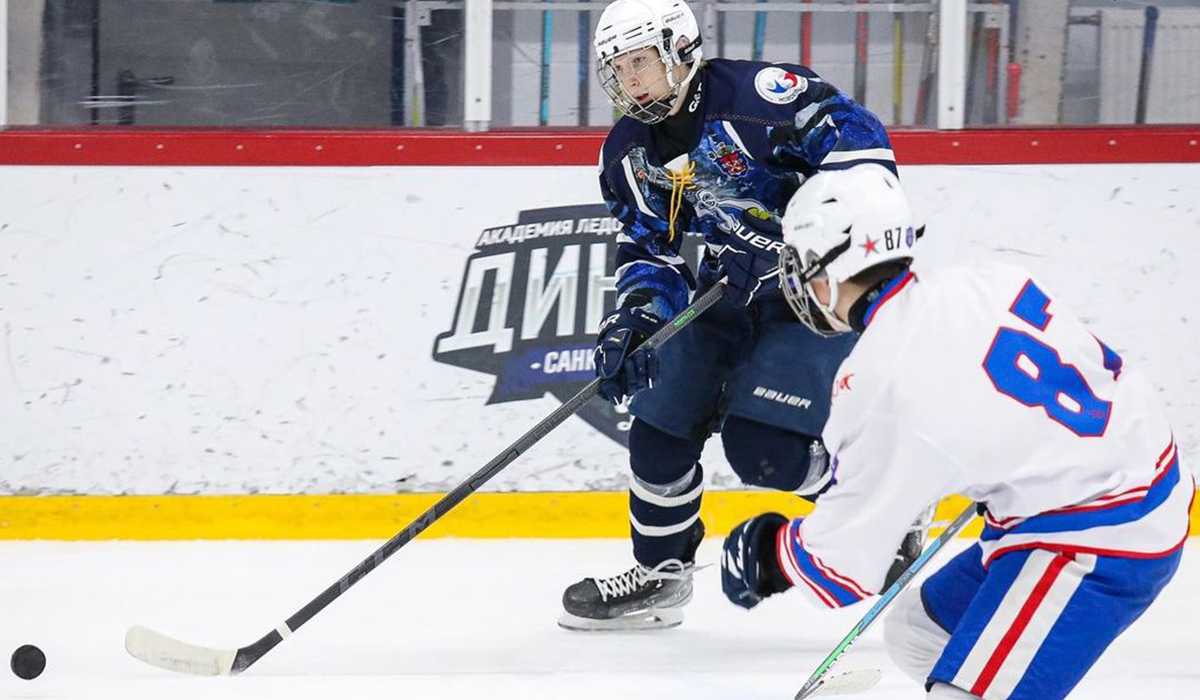 Gleb Semenov, forward for 2007-born club Dynamo St. Petersburg, skates with the puck during a game at the 2022 St. Petersburg Cup in Russia.