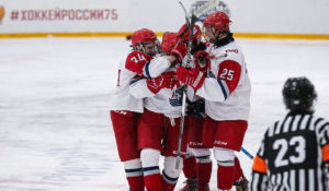 Players from 2006-born Russian youth hockey team Lokomotiv Yaroslavl celebrate a goal.