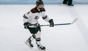 Kyle Heger, defenseman for 2007-born Shattuck St. Mary's club skates with the puck.