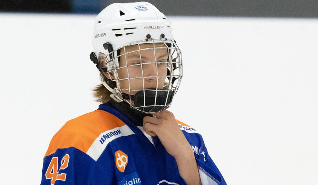 Vilho Vantahalo, forward for 2007-born Finnish youth hockey team Tappara readies for puck drop.