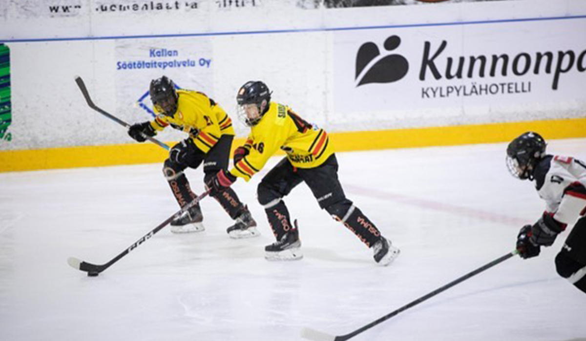 Akseli Savolainen, forward for 2009-born Finnish youth hockey team KalPa P Musta skates with the puck during a game.