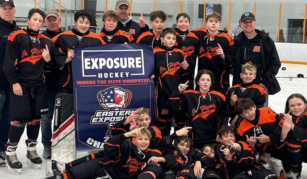 The 2010-born youth hockey team Philadelphia Jr. Flyers celebrate winning their division at the 2022 Eastern Exposure Cup.