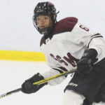 Sam Osei, defenseman for 2006-born U.S> youth hockey team Shattuck-St. Mary's skates during a game.