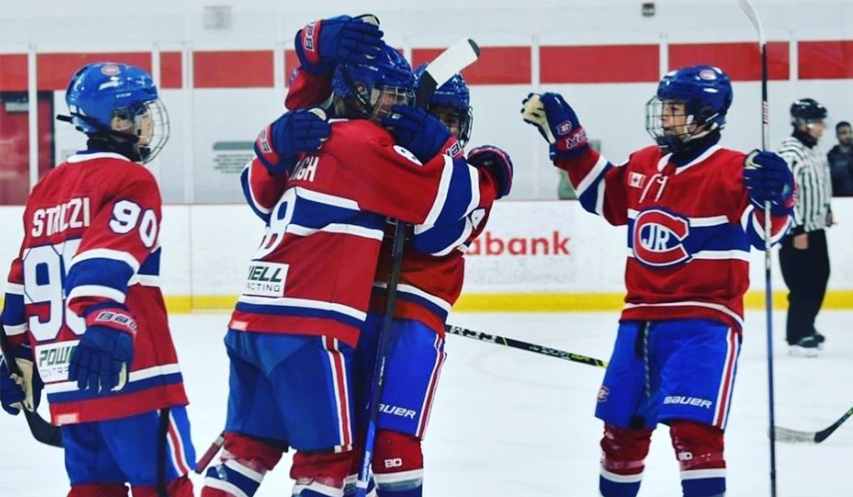 The 2009-born youth hockey team Toronto Jr. Canadiens celebrate a goal.