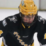 Drew Glasser, forward for 2008-born U.S. youth hockey team Pittsburgh Penguins Elite sets for a faceoff.