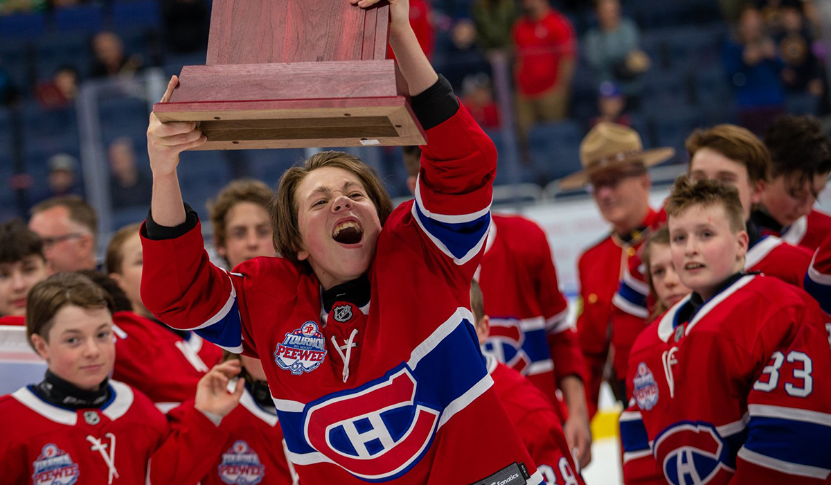 Montreal Canadiens youth hockey team celebrates winning the 2022 Pee-Wee Quebec Tournament.