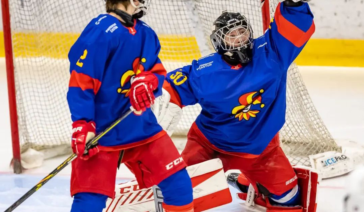 Sakari Savolainen, goaltender for 2007-born Finnish youth hockey team Jokerit makes a glove save during a game.
