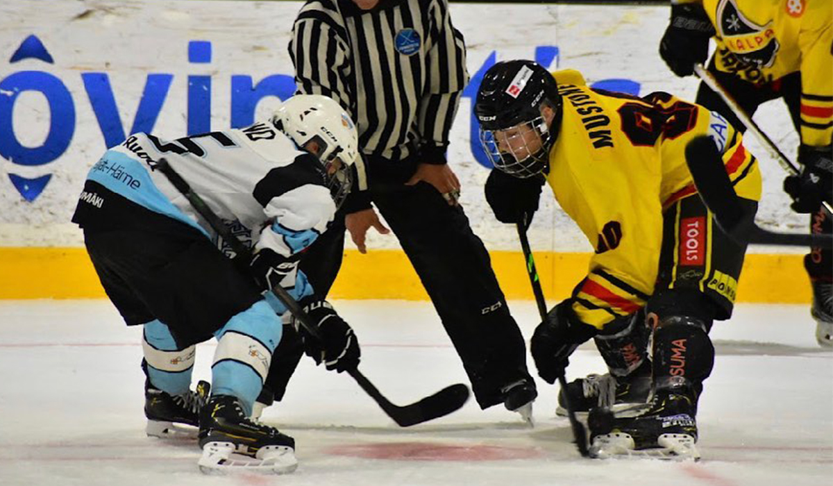 Sisu Mustonen, forward for 2007-born Finnish youth hockey team KalPa takes a faceoff.