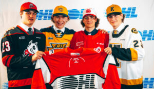 Top picks Ryan Roobroeck, Matthew Schaefer, Brady Martin and Tyler Hopkins pose for pictures at the 2023 OHL Priority Selection.