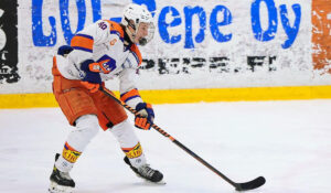 Eetu Orpana, forward for 2007-born Finnish youth hockey team Tappara skates with the puck.