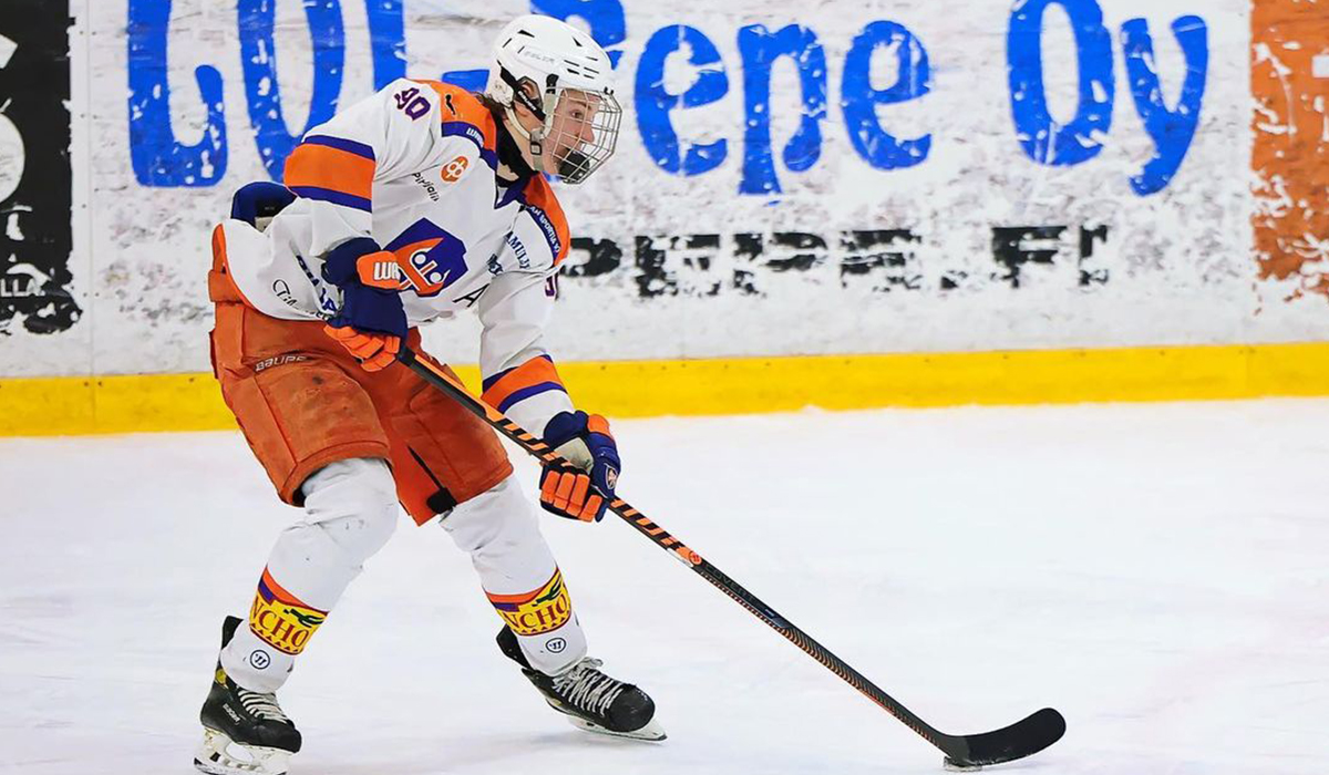 Eetu Orpana, forward for 2007-born Finnish youth hockey team Tappara skates with the puck.