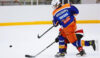 Eetu Orpana, forward for 2007-born Finnish youth hockey team Tappara fires a shot.